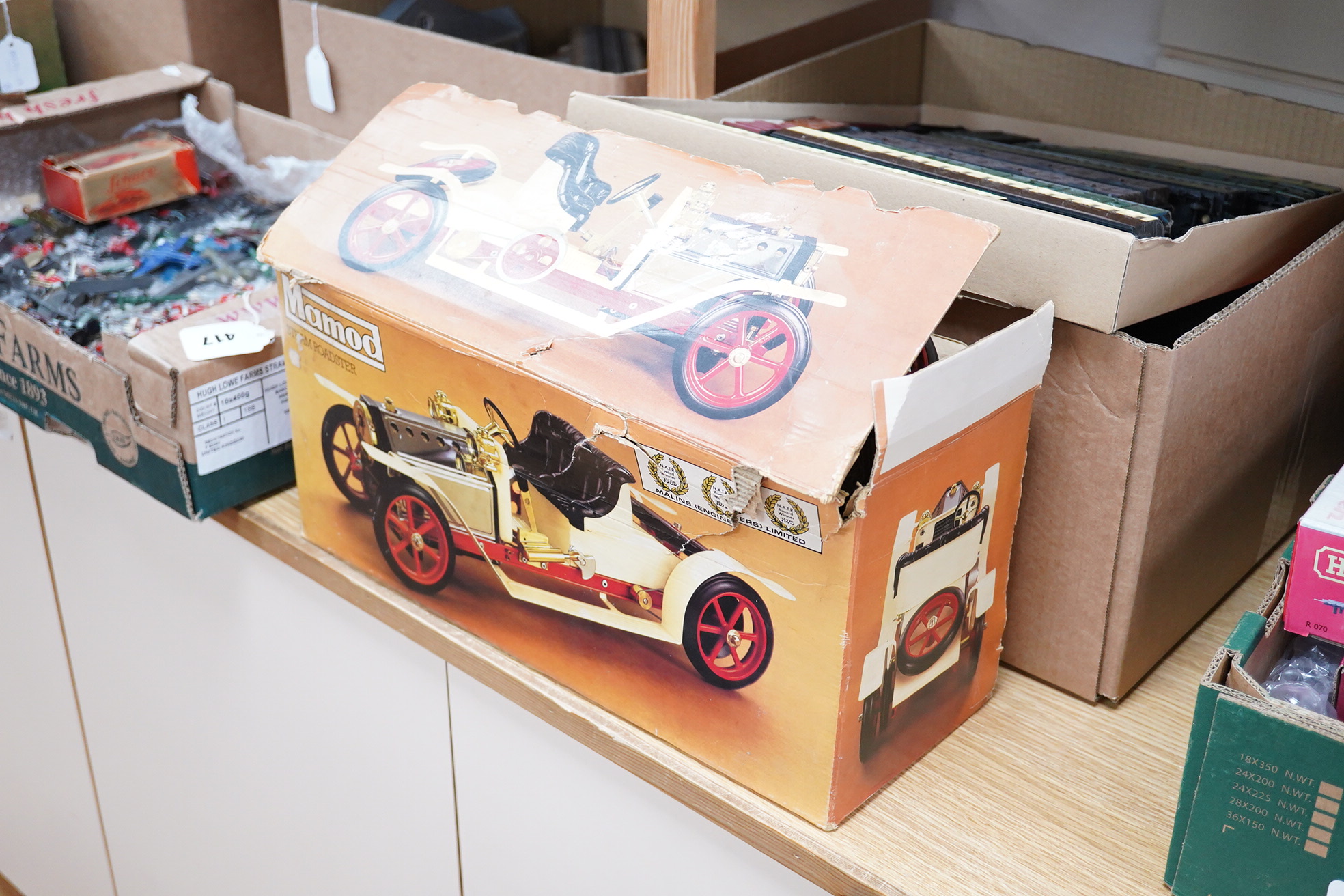 A boxed Mamod Steam Roadster, live steam, single cylinder cream painted car, together with some accessories